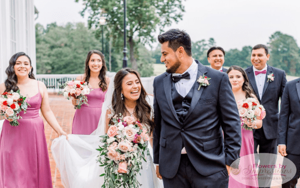 Absolutely beautiful! We love the pops of blush and burgundy among the white flowers.