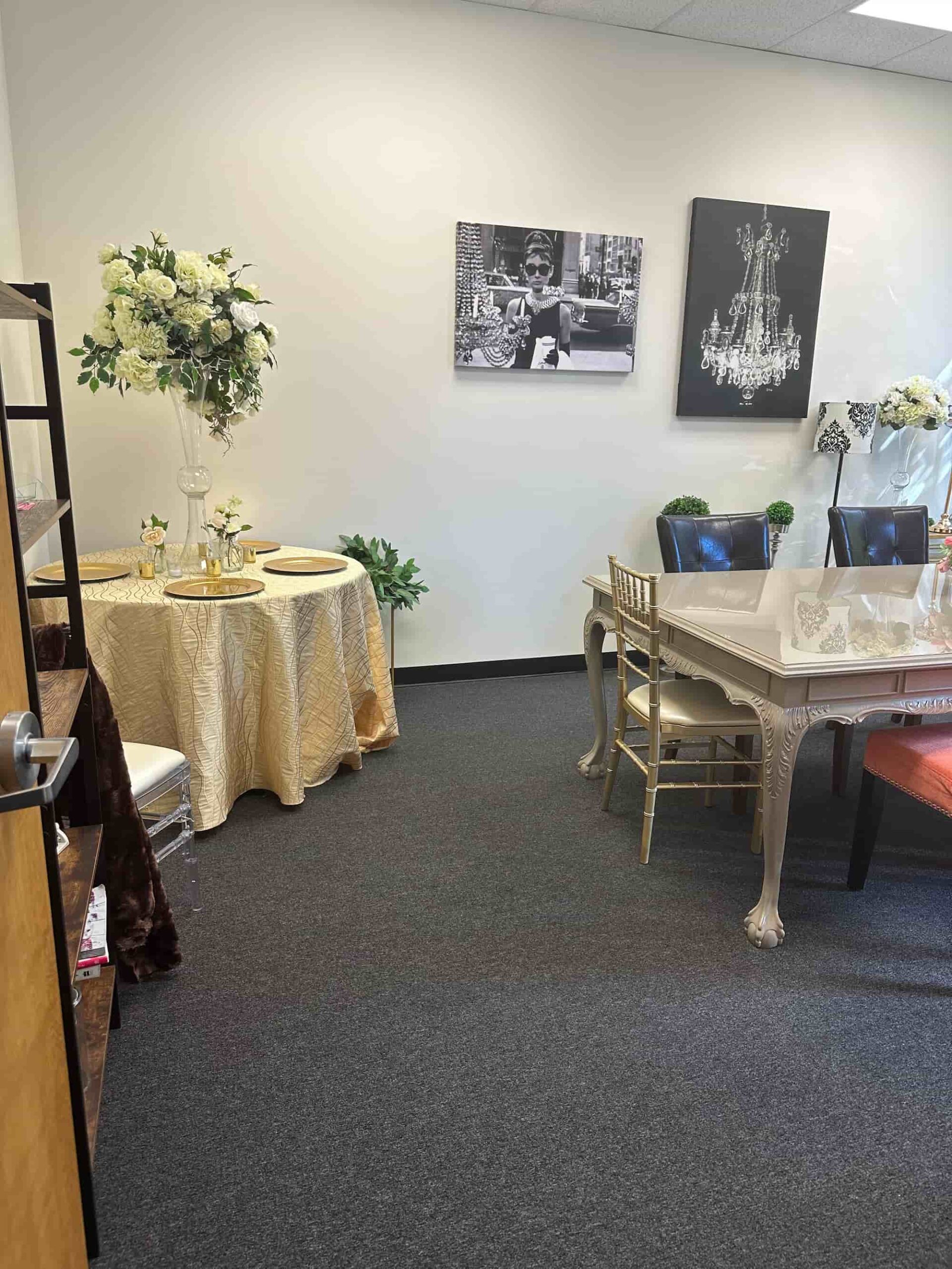 Flowers By Impressions Suwanee office showcasing floral decor and stylish artwork with a luxurious meeting area.