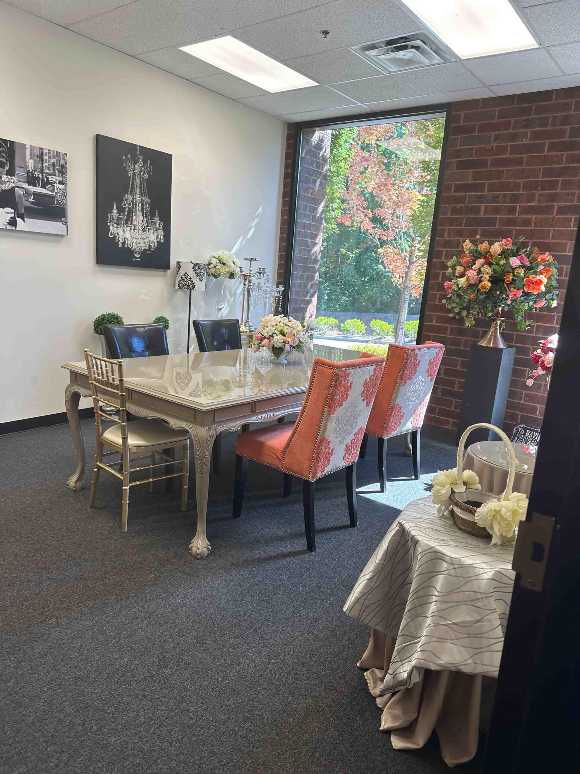 Elegant meeting space at Flowers By Impressions Suwanee office, featuring floral arrangements and modern decor.