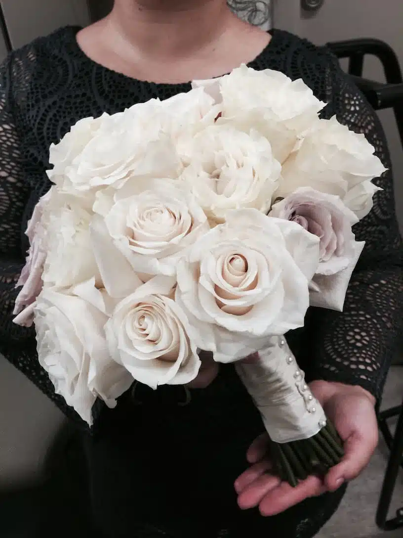 Classic white bridal bouquet with pearl-studded ribbon, featuring elegant garden roses for a Villa Christina wedding in Atlanta.