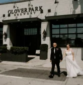 Bride and groom walking hand-in-hand outside Glover Park Brewery after their Fall wedding.