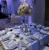 Elevated wedding centerpiece with pink and white roses and hydrangeas at Villa Christina in Atlanta.