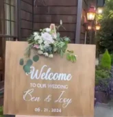 Wedding welcome sign with floral decorations,