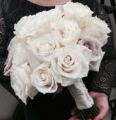 Classic white bridal bouquet with pearl-studded ribbon, featuring elegant garden roses for a Villa Christina wedding in Atlanta.