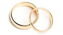 A pair of gold wedding rings symbolizing eternal love and commitment.