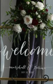 Welcome sign wedding arrangement with floral decor