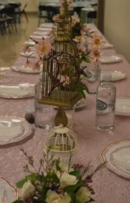 meticulously arranged banquet table that exudes a whimsical and elegant charm, perfect for a special event or wedding reception.